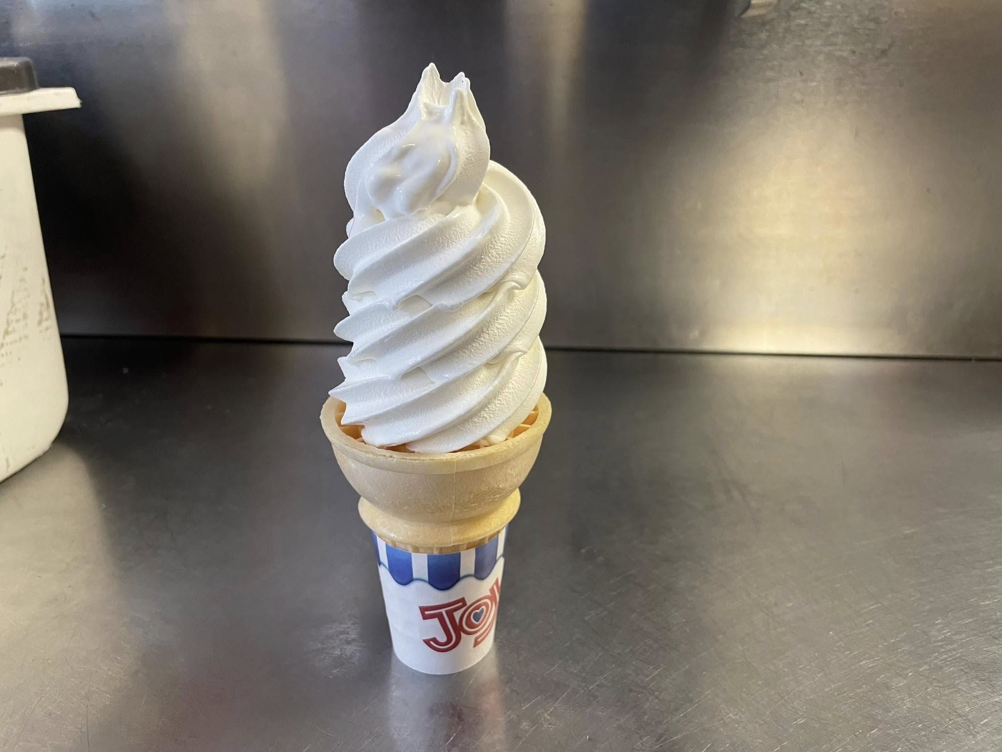 Soft serve vanilla ice cream cone